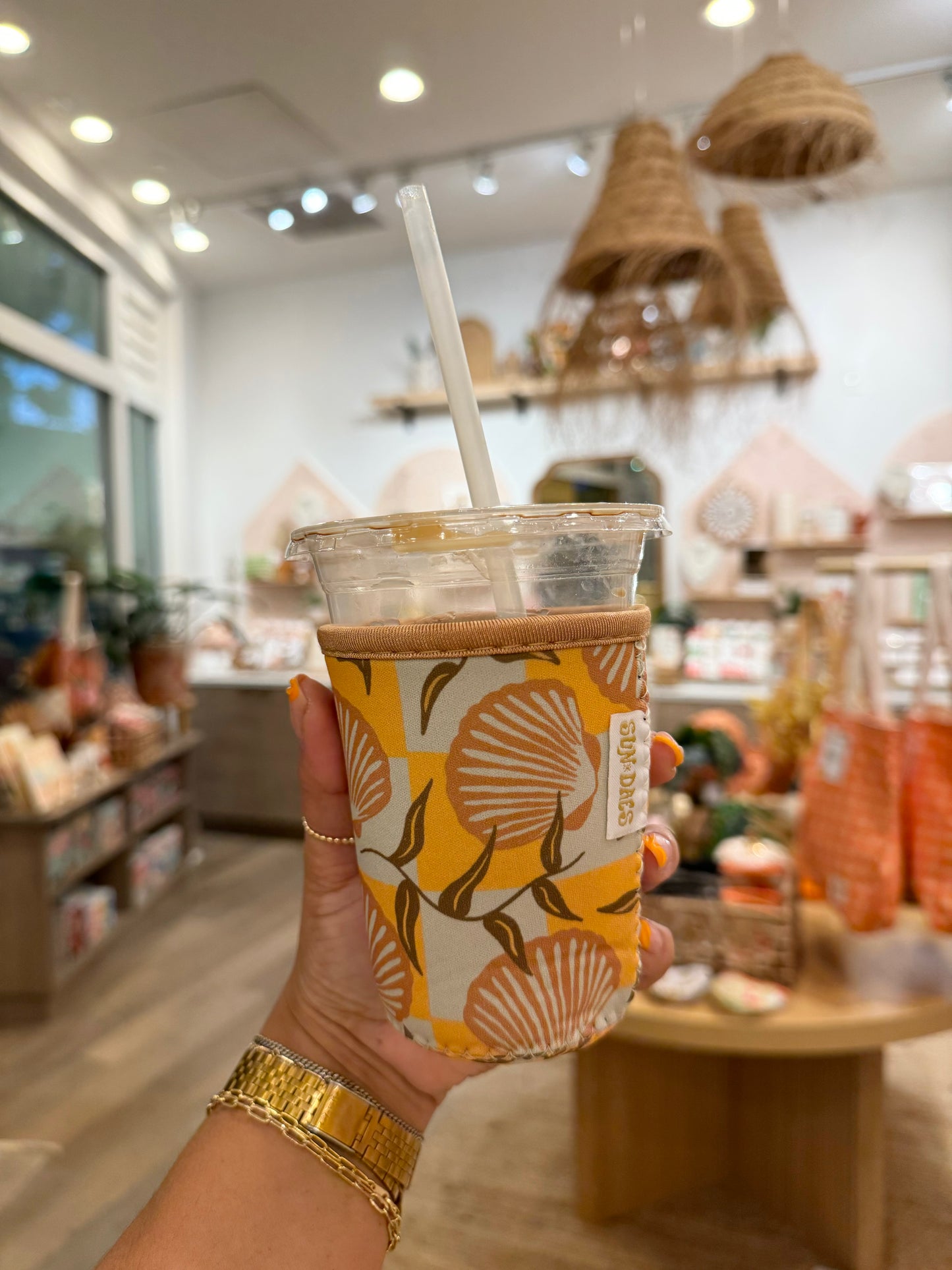 Checkered Sunrise shell coffee sleeve small
