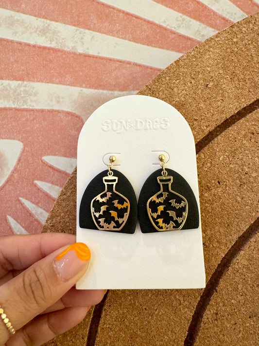 Arched potion dangles